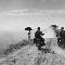 Dei motociclisti e una donna percorrono la strada da Nam Dinh a Thai Binh, Indocina (Vietnam), maggio 1954