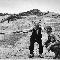 Robert Capa, [Sicilian peasant telling an American officer which way the Germans had gone, near Troina, Sicily], August 4-5, 1943.